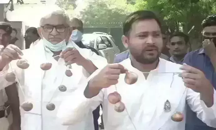 Price hike: Tejashwi Yadav slams on BJP with onion garland