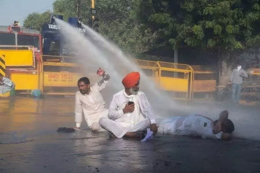 Farmers protest spills over police barricades in Haryana