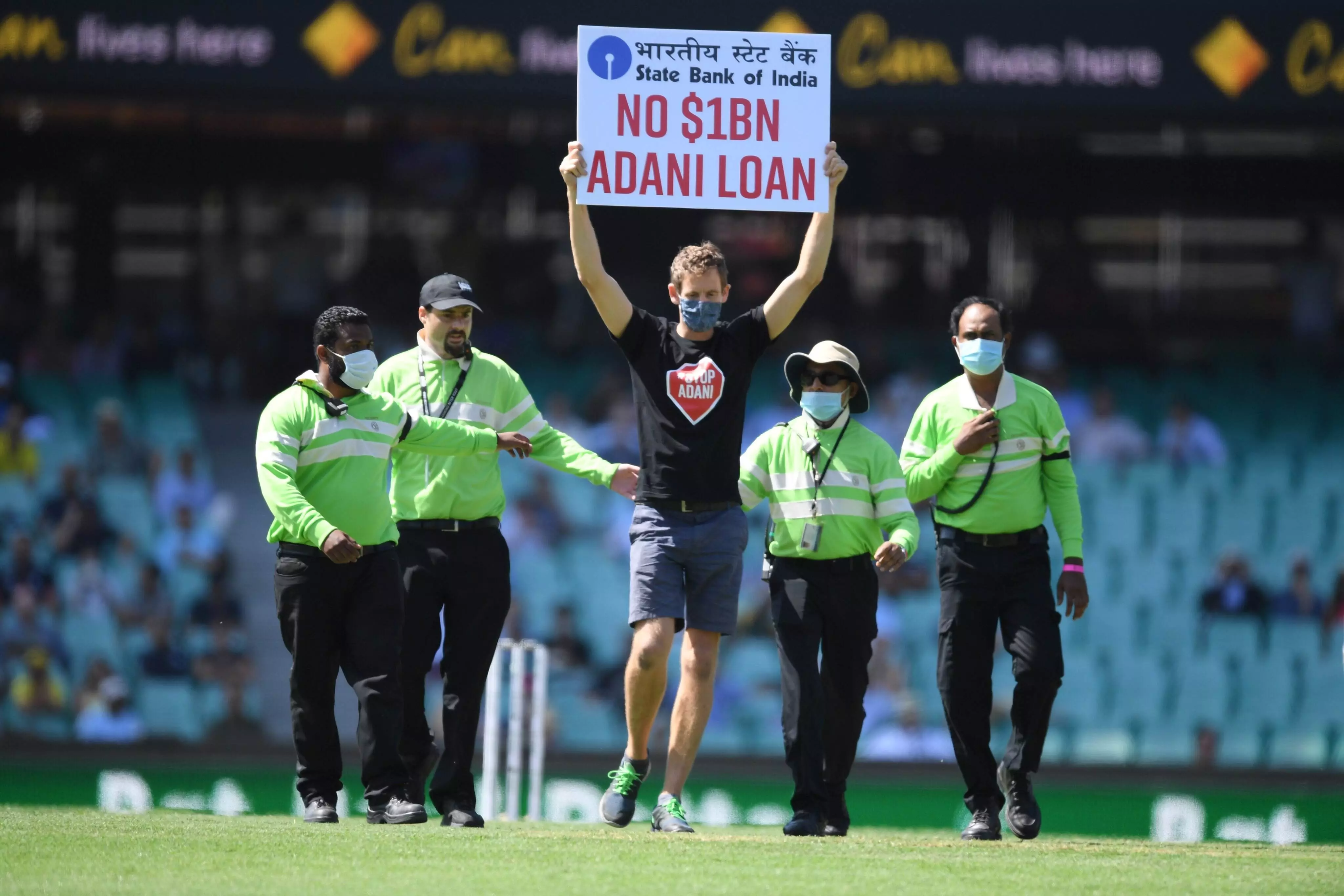 Spectator runs on to field with No $1BN Adani Loan protest sign during first Ind vs Aus ODI