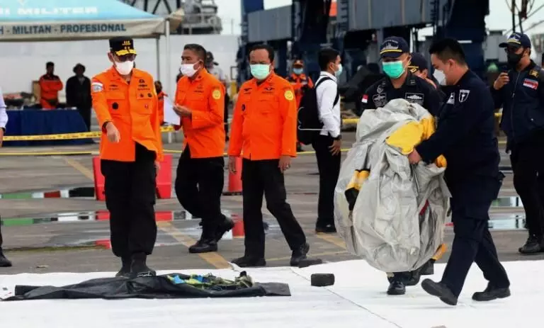 Body Parts from crashed Indonesian Plane found at the site