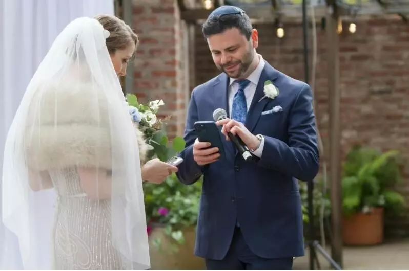 Coinbase employees exchanges digital NFT rings with wedding vows