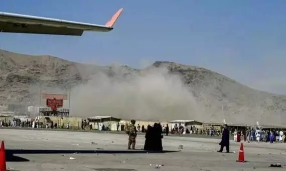 US warns of credible threat at Kabul airport as Biden pledges more strikes on IS