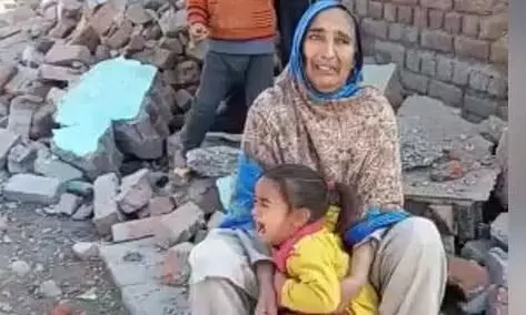 Tribal families in Srinagar protest the demolition of their homes