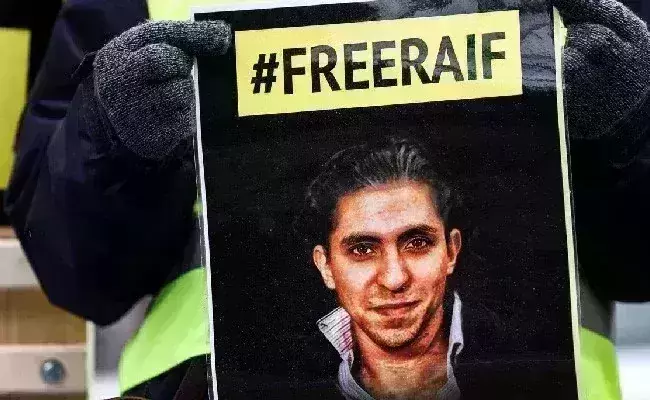 Saudi Arabia releases jailed blogger Raif Badawi and warns him not to leave the kingdom