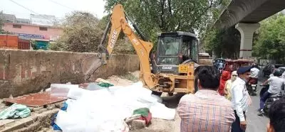 Bulldozers roll near Rithala metro station in Delhi