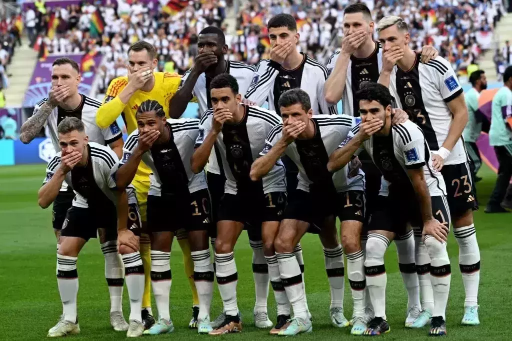 Germany players cover mouths to protest against FIFAs One Love armband ban