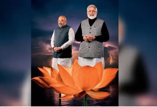 Modi Govts dress code change: khaki and lotus logo for parliament staff, a political statement